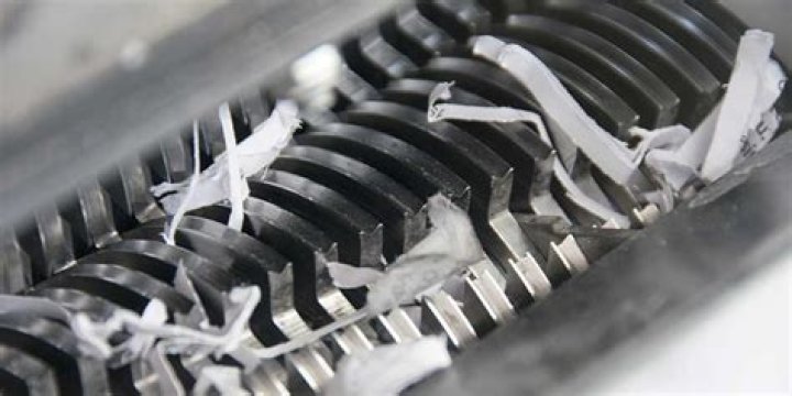 How do you get stuck paper out of a shredder?