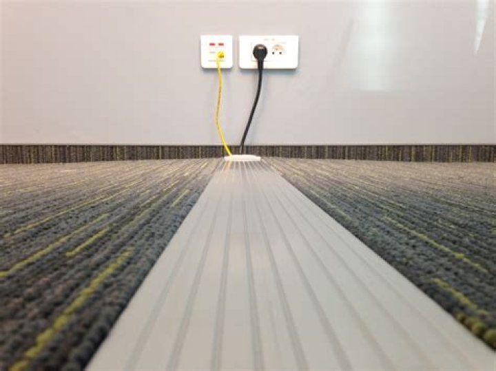 How do you get wire under carpet?
