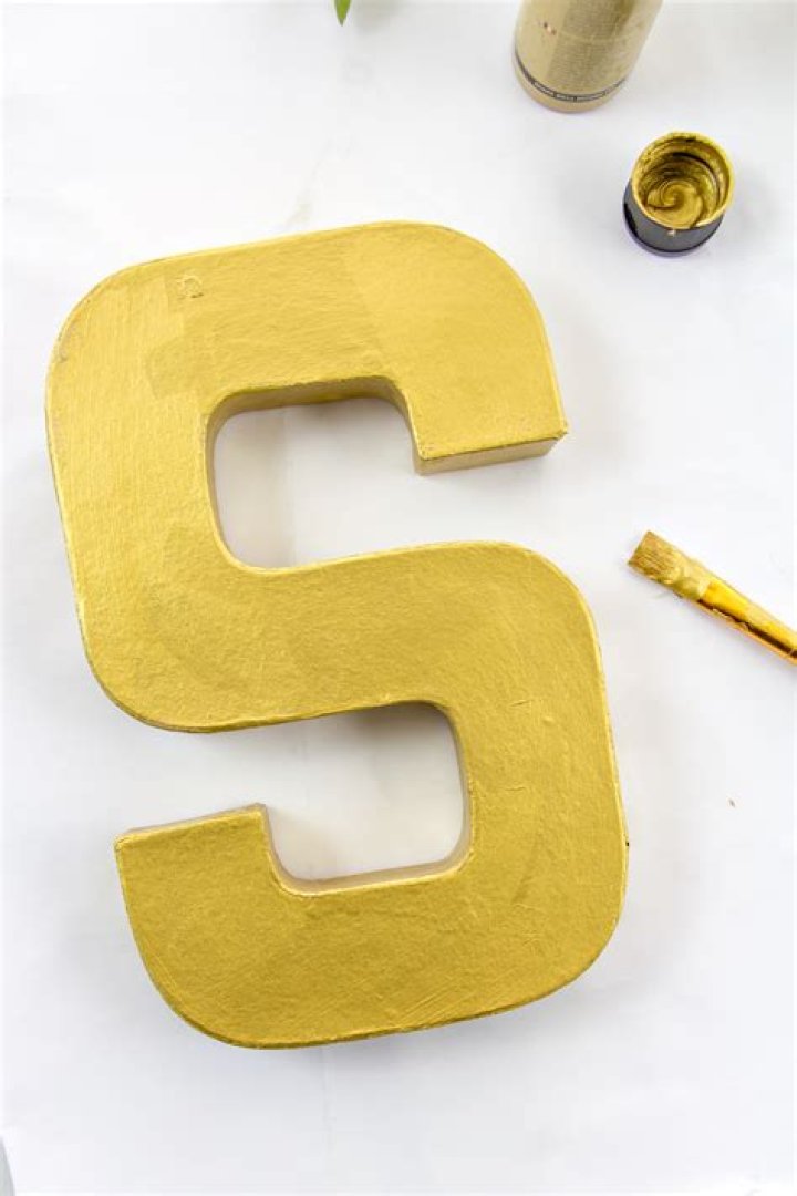 How do you paint on paper mache letters?
