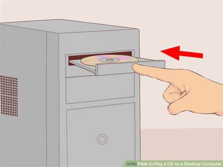 How do you play a CD on a computer?