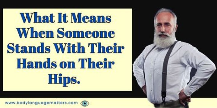 What does standing with hands on hips mean?